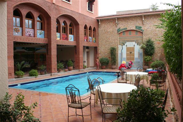 Outdoor pool area of Al Kabir Hotel Marrakech