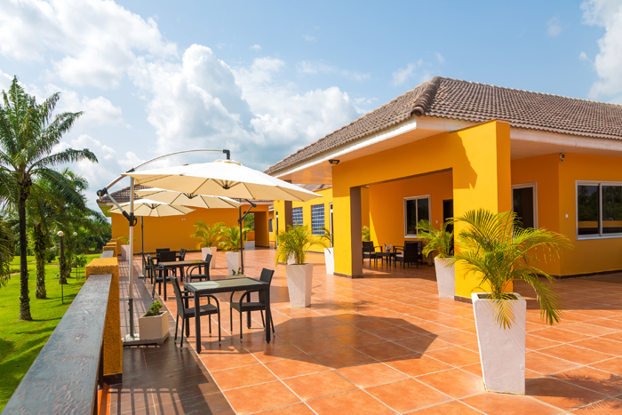 Outdoor terrace with large umbrella and table combinations