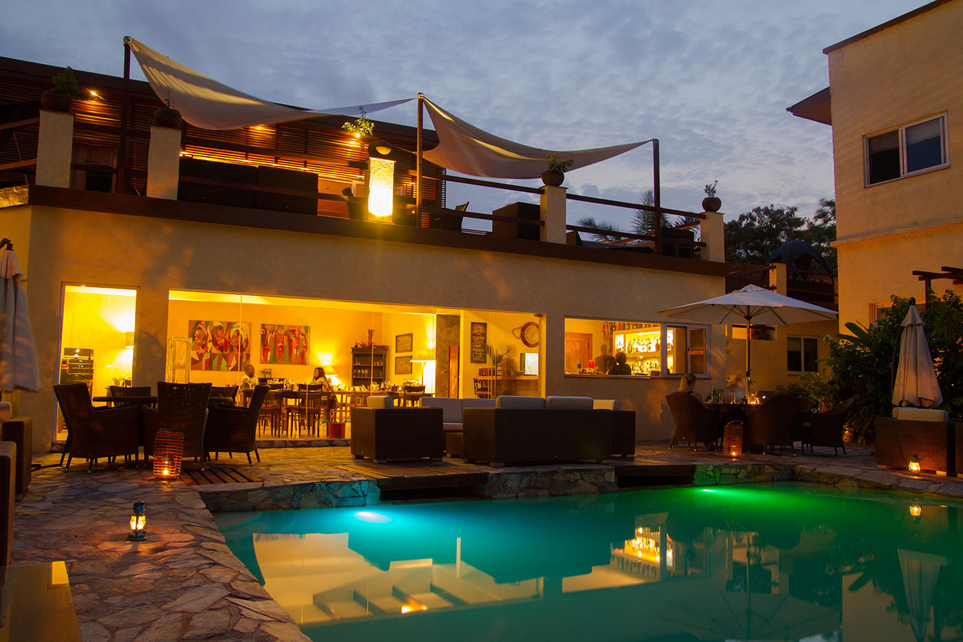 Outdoor bar and pool area of La Villa Boutique Hotel