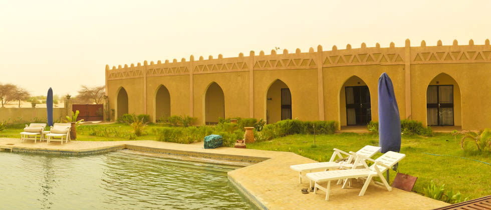 Outdoor pool area of Hotel La Palmeraie Timbuktu