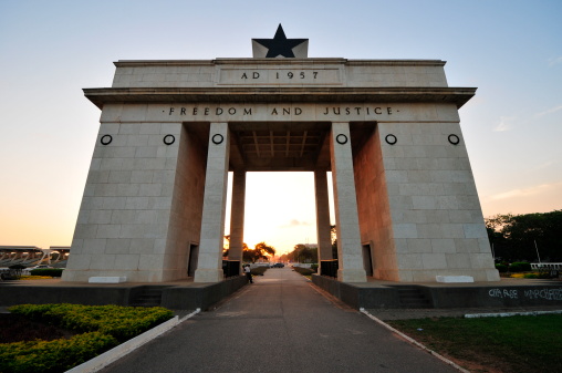 Frontal view of Independence Black Square Arch in Accra during a sunset