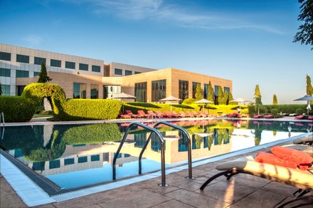 Outdoor pool area of Al Salam Rotana Hotel