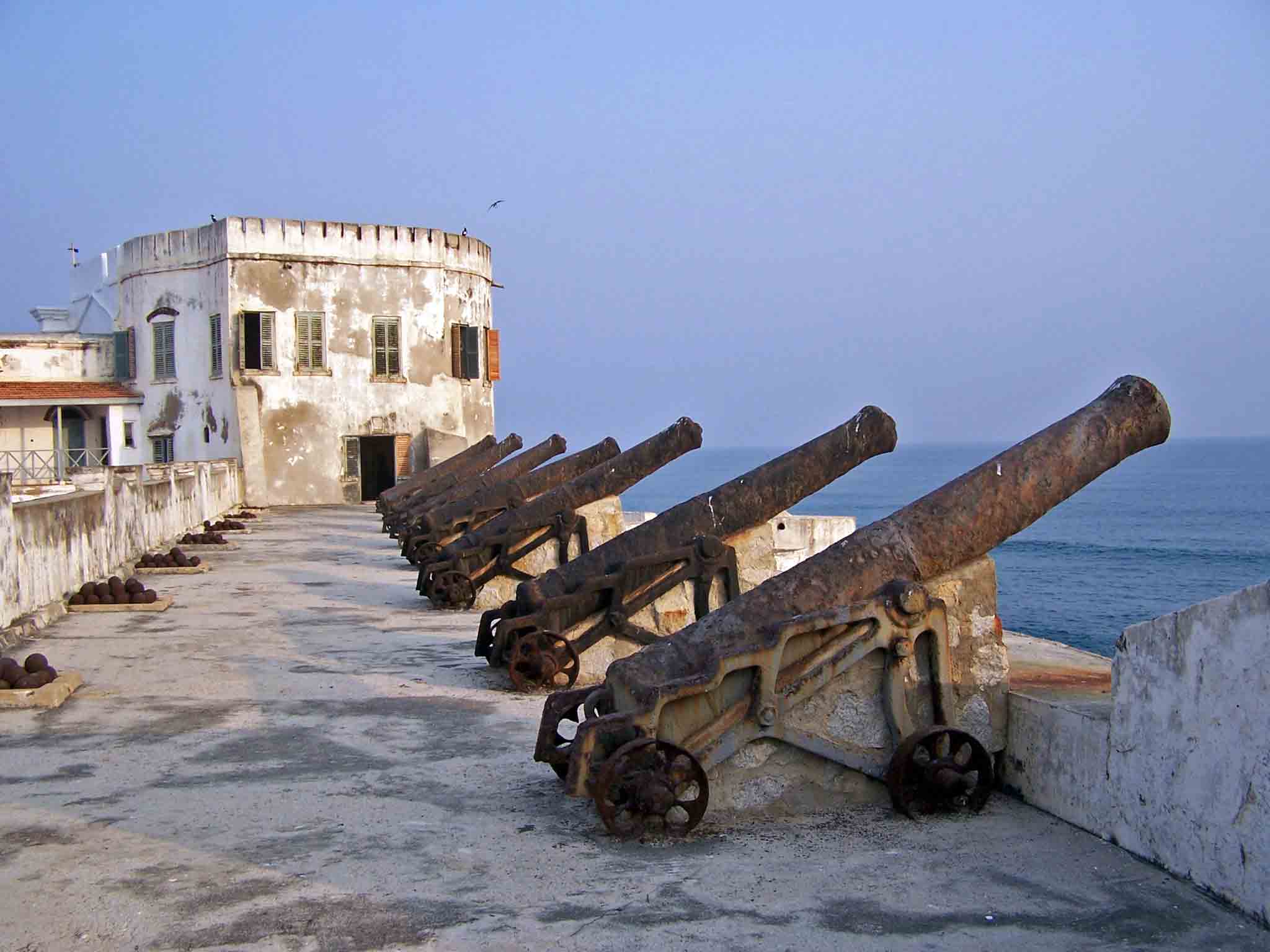 Cannons sitting on a castle wall