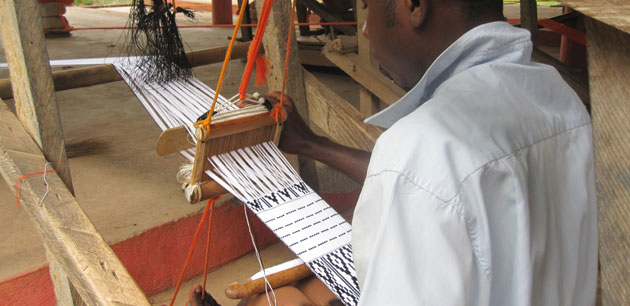 A man working on a loom - Panafest 21st Anniversary Celebration