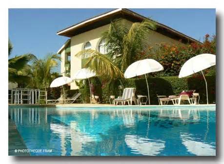 Outdoor pool area of Hotel Les Flamboyants