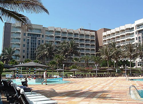 Outdoor pool area of Le Meridien President