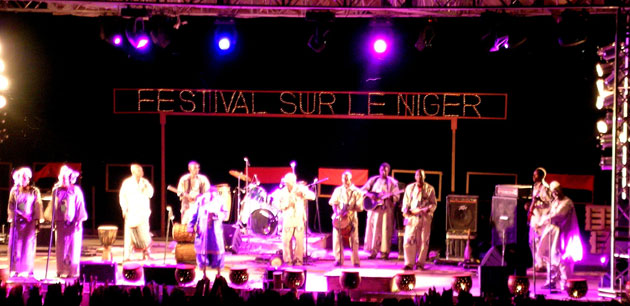 People preforming on a stage - Festival On The Niger