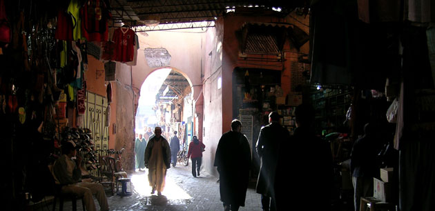 People walking in a partially covered market - Archaeological Tour Of Morocco