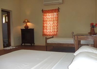 View of hotel room with two beds