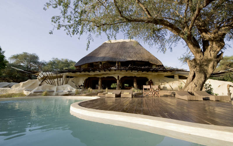 Outdoor pool area of Muchenje Lodge Chobe
