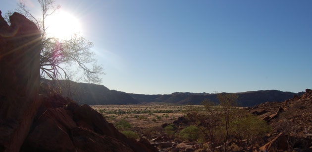 View of a desert area surrounded by hills - Namibia Highlights