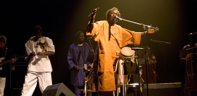 Men performing music on a stage - St-Louis International Jazz Festival - Dak‘Art & St Louis Jazz Festival Senegal