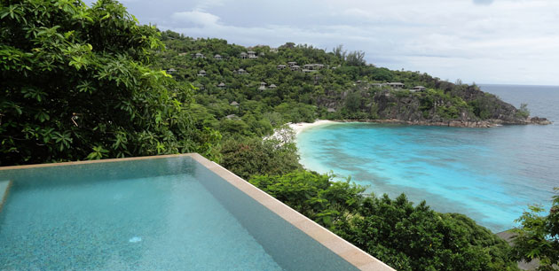 An infinity pool with a view of the beach